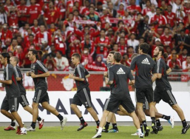 Liverpool train in front of their Malaysian fans - not an AON or AIG logo in sight.