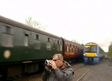 A trainspotter narrowly avoids being struck by a train in the UK