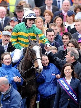 Tony McCoy takes the congratulations of owner JP McManus.