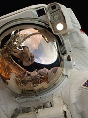 Space walking astronaut John Grunsfeld