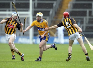 Clare's Conor McGrath with Tommy Walsh and TJ Reid of Kilkenny