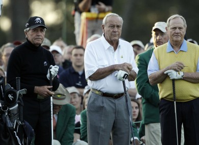 Honorary players Gary Player, Arnold Palmer and Jack Nicklaus wait to tee off on the first hole..