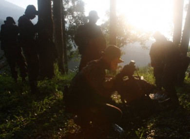 Indonesian soldiers get ready to find the location of a plane crash at Taman Nasional Halimun Salak in Sukabumi, West Java.