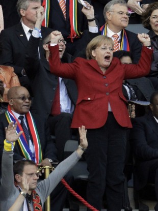 Angela Merkel celebrates next to South African President Jacob Zuma during the 2010 World Cup.