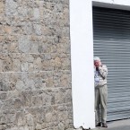A pilgrim tries to find a quiet spot to take a phone call 

Laura Hutton/Photocall Ireland