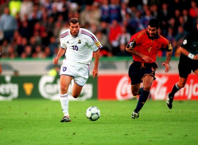 Zinedine Zidane takes the ball away from Spain's Josep Guardiola.