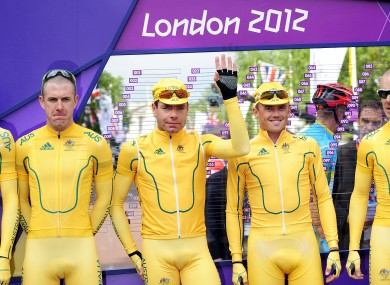 Cadel Evans (centre) with his Australian teammates before yesterday's road race.