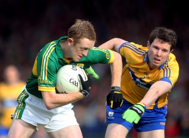 Kerry's Colm Cooper and Kevin Harnett of Clare.
