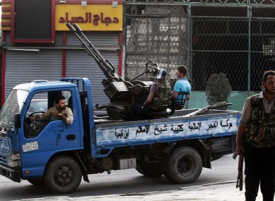 Free Syrian Army soldiers are seen at the border town of Azaz, some 20 miles north of Aleppo on Sunday.