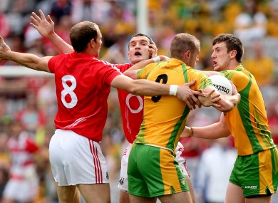Cork's Alan O'Connor and Graham Canty with Neil Gallagher and Leo McLoone of Donegal.
