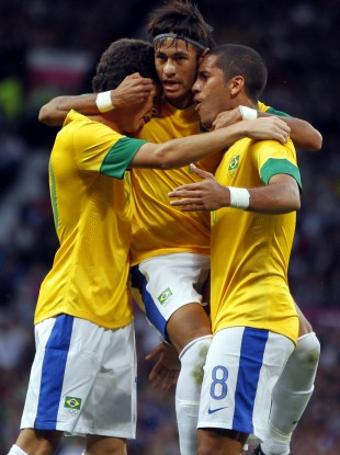 Brazil's Romulo celebrates his goal.