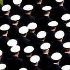 Members of the Navy Midshipmen take to the field before the game.  ©INPHO/James Crombie