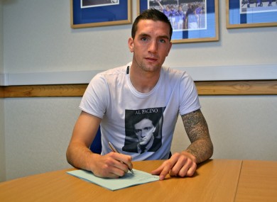 Duffy signs his new deal.