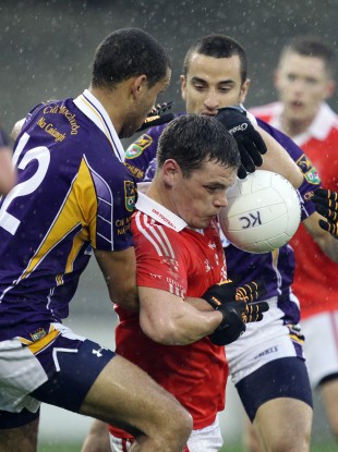 Kilmacud Crokes' Craig Diaz and Declan Kelleher tackle John O'Loughlin of St Brigid's in last year's meeting between the clubs.