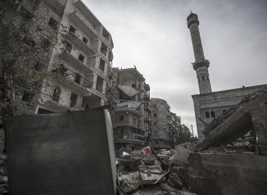 A mosque minaret still stands amid rubble from damaged buildings after an aircraft strike hit the mosque one week ago in the Tarik Al-Bab neighborhood, southeast of Aleppo, Syria