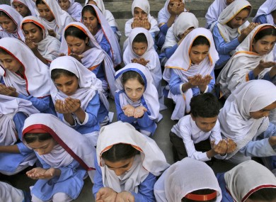 Pakistani students pray for the recovery of 14-year-old schoolgirl Malala Yousufzai in Peshawar, Pakistan.