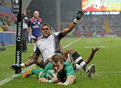 Craig Gilroy dives over for Ireland's first try.