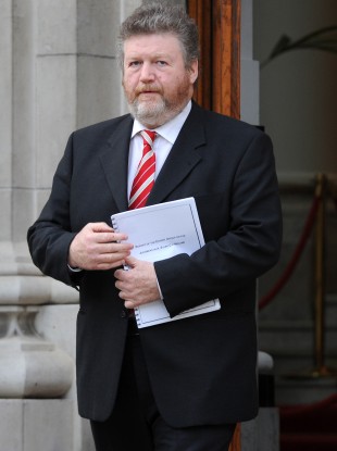 Fine Gael Minister for Health, Dr James Reilly with a copy of the report