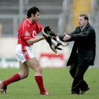 Cork defender Sean Óg Ó hAilpin then intervenes to ensure the game can proceed to the final whistle in Thurles.