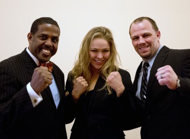 Ronda Rousey, center, and Nick Catone pose with Brooklyn senator Kevin Parker.