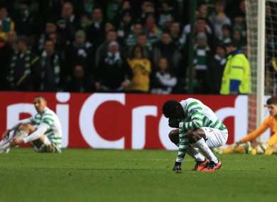 Celtic's Efe Ambrose stands dejected after Juventus' third goal.