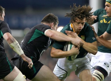 Cian Healy tackles Zane Kirchner last November.