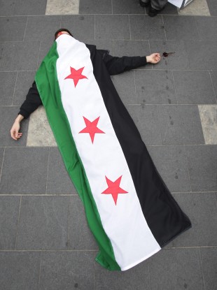 A member of the Federation of Student Islamic Societies in Dublin takes part in a flashmob last March on O'Connell Street to highlight human rights abuses by the Assad regime