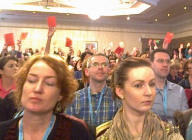 Red cards were held up as Minister Quinn began his address this morning.