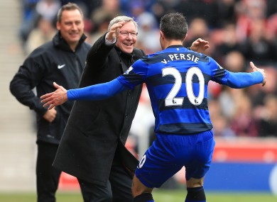 Manchester United's manager Sir Alex Ferguson celebrates with Robin Van Persie after scoring their second goal.
