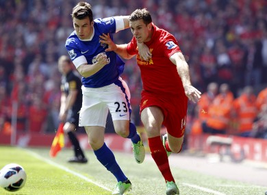 Seamus Coleman and Jordan Henderson battle for possession.