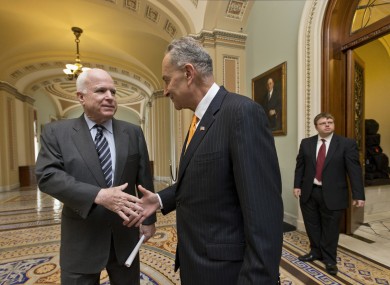 Sen. John McCain, R-Ariz., left, and Sen. Charles Schumer, D-N.Y., right, two of the authors of the immigration reform bill crafted by the Senate's bipartisan