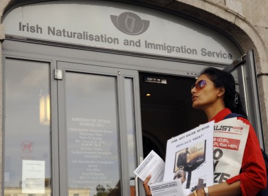 A protestor against racism against immigrants outside the Irish Naturalisation and Immigration Service HQ on Dublin's south quays.