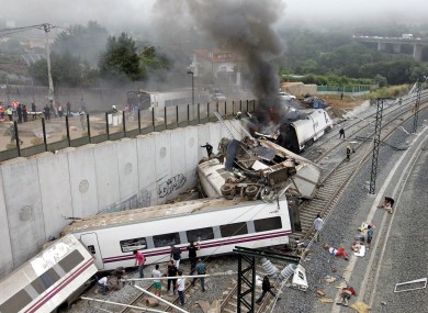 Emergency personnel respond to the scene of a train derailment in Santiago de Compostela, Spain.