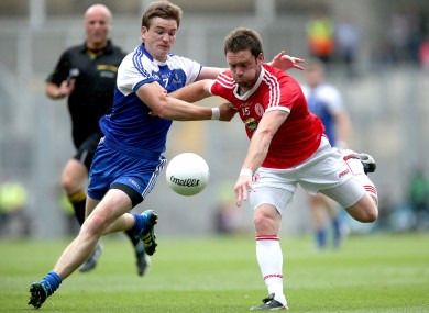 Monaghan's Dessie Mone and Martin Penrose of Tyrone do battle.