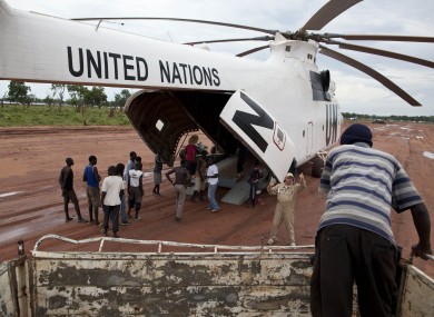 A World Food Programme (WFP) truck backs up to load food items from a recently landed UN helicopter, in Yida camp, South Sudan