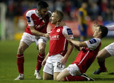 Daryl Kavanagh is mobbed by his Pat's team-mates after scoring.