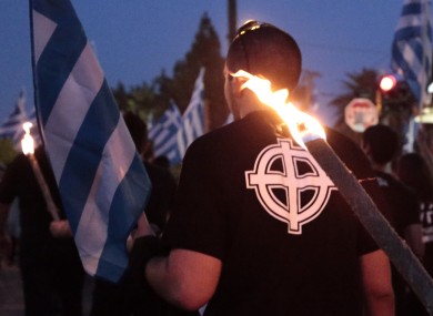 A supporter of Golden Dawn takes part in a march in Athens.