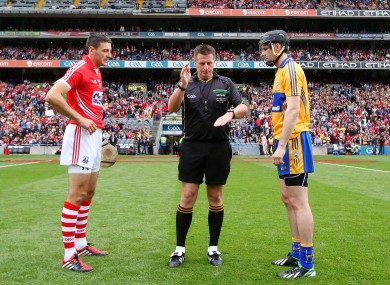 Cork's Patrick Cronin and Patrick Donnellan of Clare with referee Brian Gavin at the coin toss ahead of the first game.