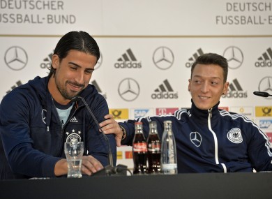 Özil (right) takes questions with Sami Khedira earlier today.