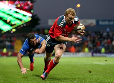 Keith Earls races past a despairing Rob Kearney to score for Munster.