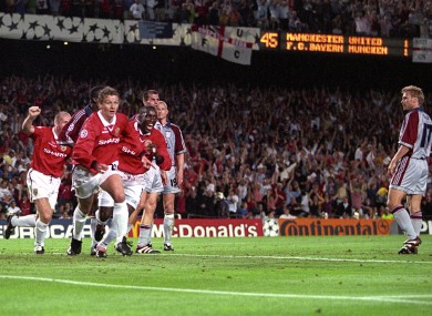 Ole Gunnar Solskjaer celebrates scoring the winning goal, chased by teammates Jaap Stam and Dwight Yorke.